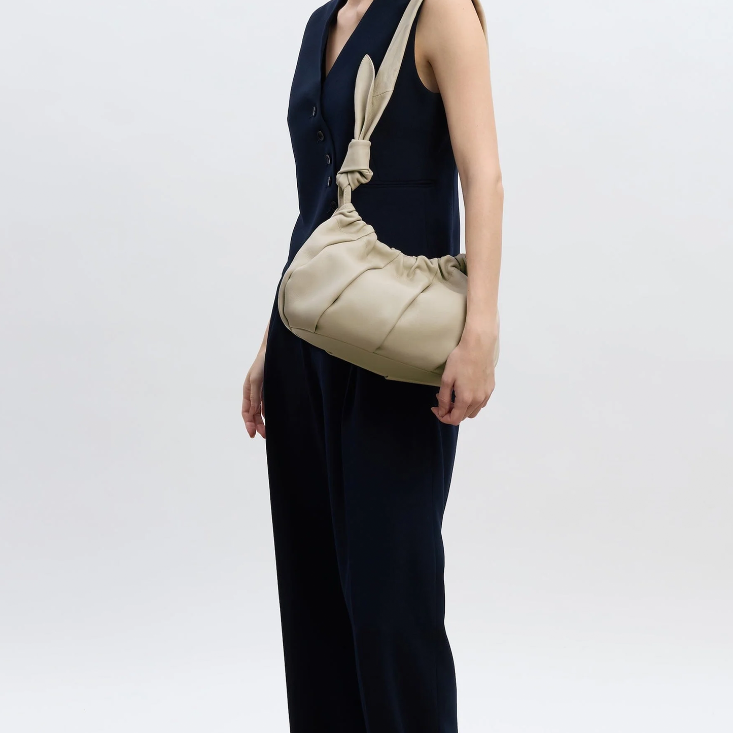 Calm Oat Neutral Gathered Pleat Crescent Shoulder Bag With Leaf Knotted Strap Detail And Hidden Magnetic Fastening
