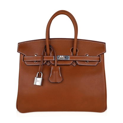 Warm Vintage Tan Smooth Compact Trapezoid Hand Tote With Crisp Contrast Stitching And Sleek Cool Silvery Twist Lock Hardware