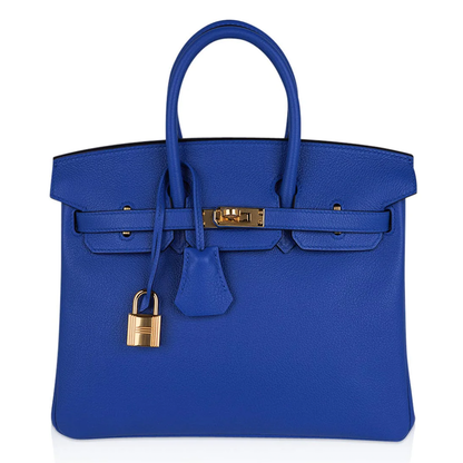 Vivid Saturated Cobalt Blue Pebble Grain Compact Trapezoid Hand Tote With Luminous Warm Golden Twist Lock Hardware And Matching Suspended Engraved Metal Padlock Charm
