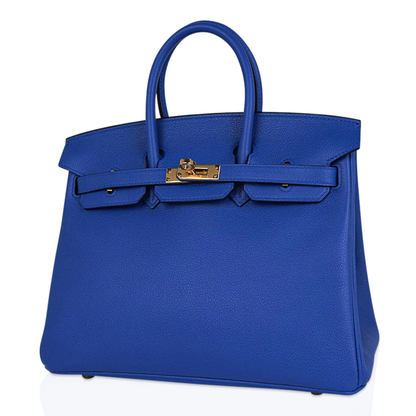 Vivid Saturated Cobalt Blue Pebble Grain Compact Trapezoid Hand Tote With Luminous Warm Golden Twist Lock Hardware And Matching Suspended Engraved Metal Padlock Charm