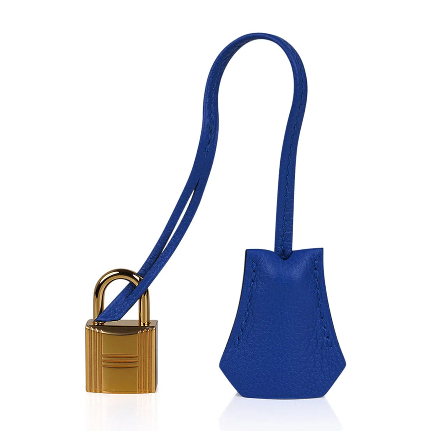Vivid Saturated Cobalt Blue Pebble Grain Compact Trapezoid Hand Tote With Luminous Warm Golden Twist Lock Hardware And Matching Suspended Engraved Metal Padlock Charm
