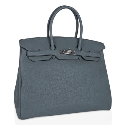 Muted Sage Grey-Green Pebble Grain Large Trapezoid Hand Tote With Cool Polished Silvery Twist Lock Hardware And Matching Textured Suspended Metal Padlock Charm